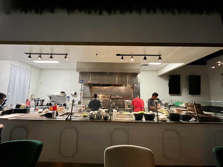 open kitchen with chefs cooking